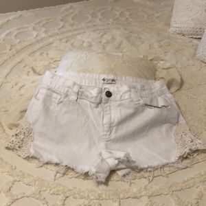White denim shorts with design